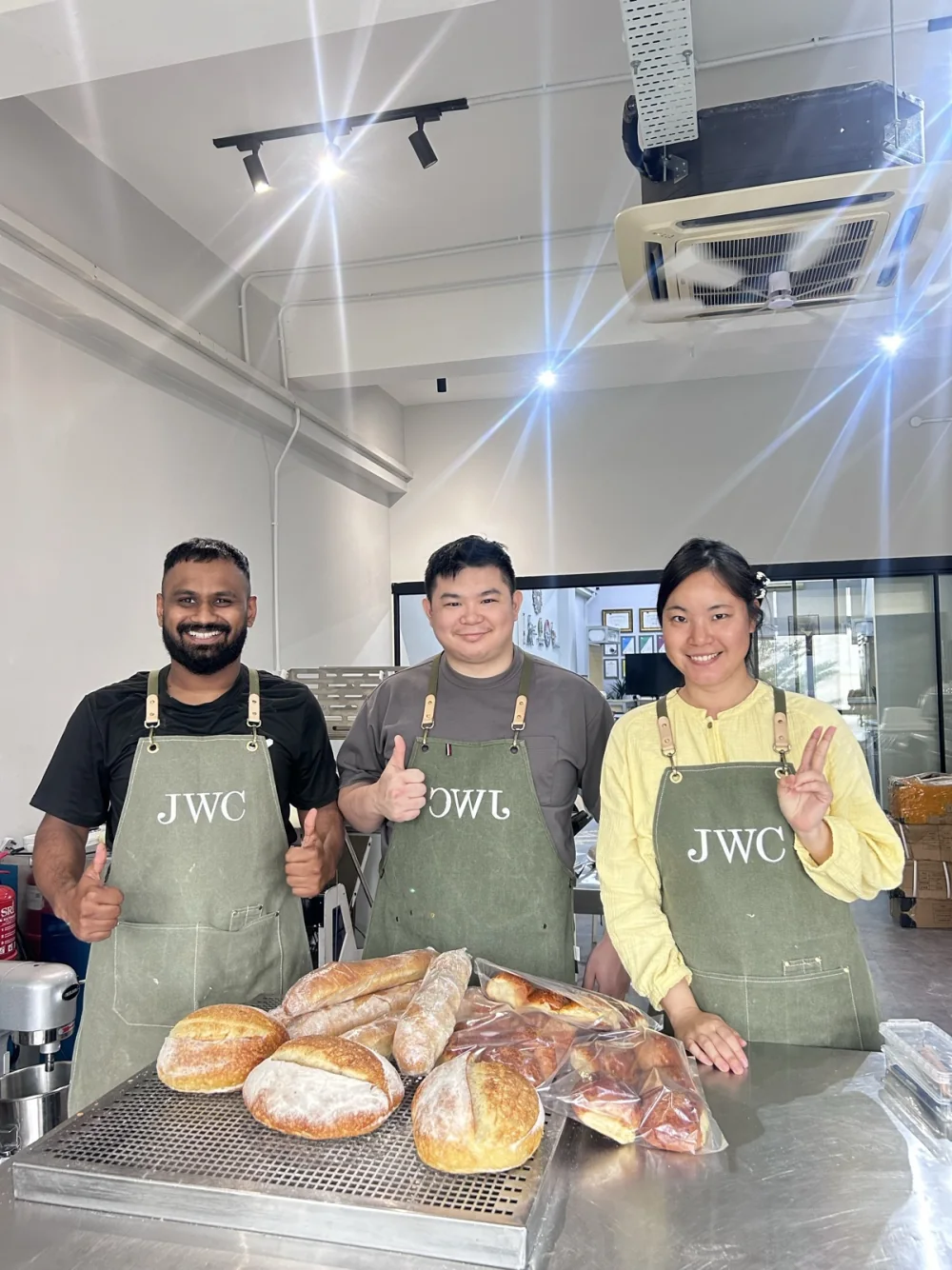 Siew Wei and BWC learners presenting breads made during class